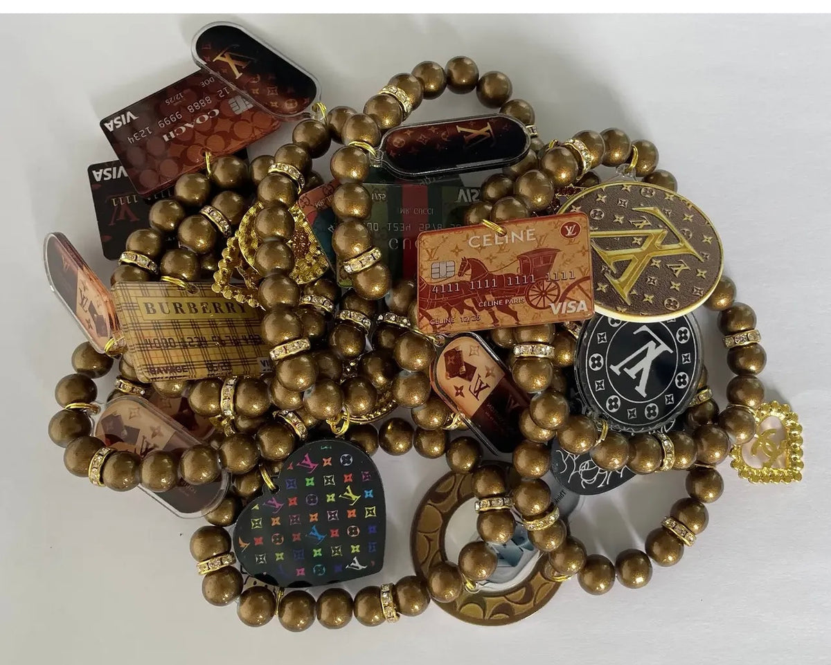 Designer Inspired Three Piece Bronze Mix Charm Bracelet Set
